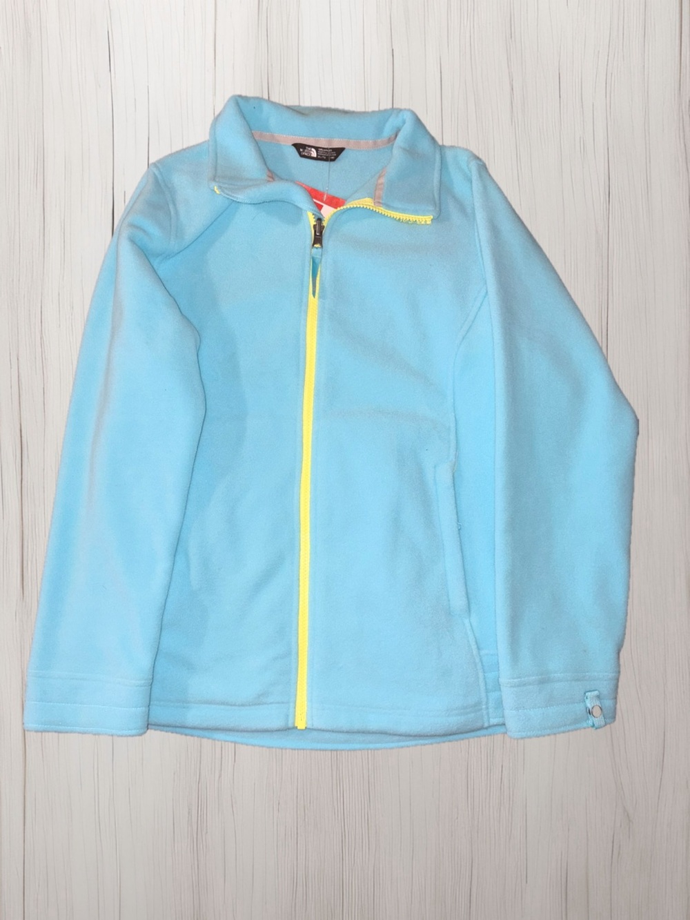 The North Face Kids Light Blue Fleece Jacket with Yellow Zipper